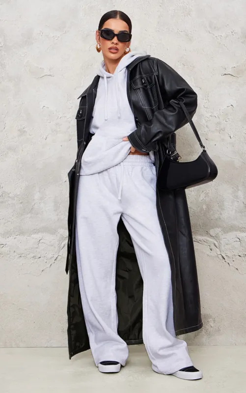 Black Faux Leather Contrast Stitch Split Hem Trench Coat sold by Pretty Little Thing