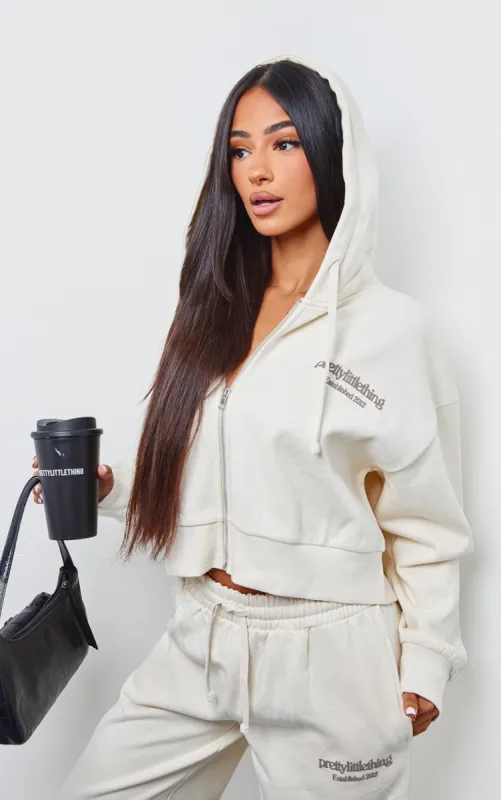PRETTYLITTLETHING Petite Cream Premium Print Zip Front Hoodie sold by Pretty Little Thing