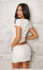 Petite Cream Faux Leather Ruched Asymmetric Top sold by Pretty Little Thing