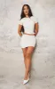 Petite Cream Faux Leather Ruched Asymmetric Top sold by Pretty Little Thing