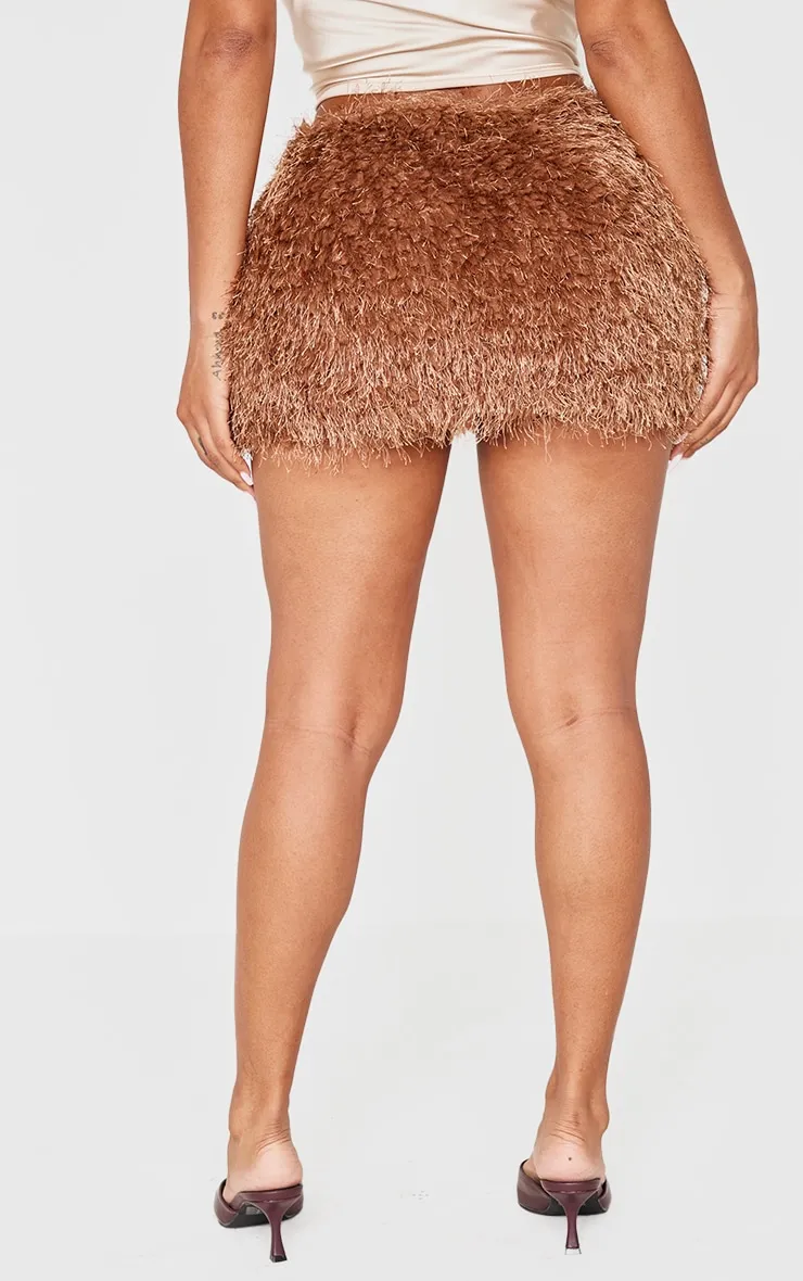 Shape Chocolate Low Rise Faux Leather Tassle Mini Skirt sold by Pretty Little Thing product image thumbnail 3