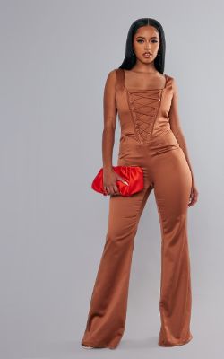 Rust Satin Lace Up Boned Strappy Wide Leg Jumpsuit sold by Pretty Little Thing