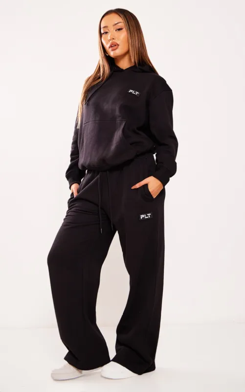 PRETTYLITTLETHING Petite Black Badge Detail Straight Leg Joggers sold by Pretty Little Thing