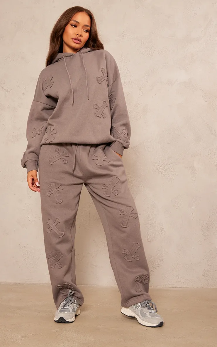 Petite Charcoal Cross Applique Embroidered Joggers sold by Pretty Little Thing