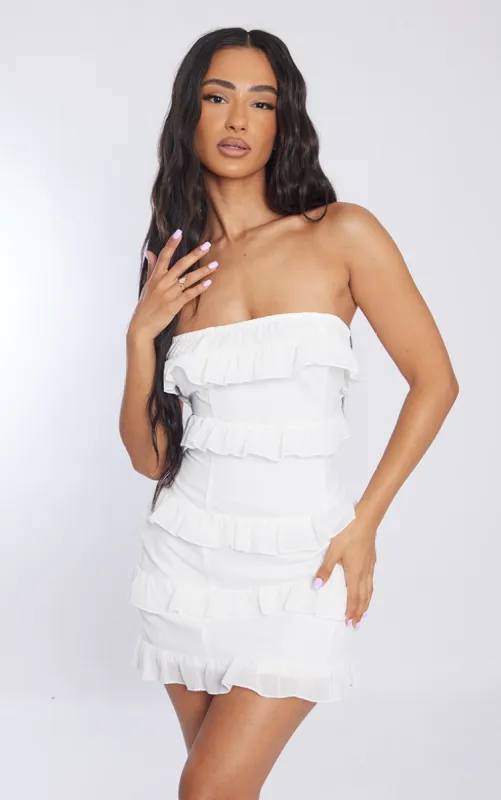 Petite White Frilled Bandeau Mini Dress sold by Pretty Little Thing