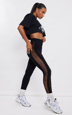 Black Contour Rib Laddered Detail Leggings sold by Pretty Little Thing