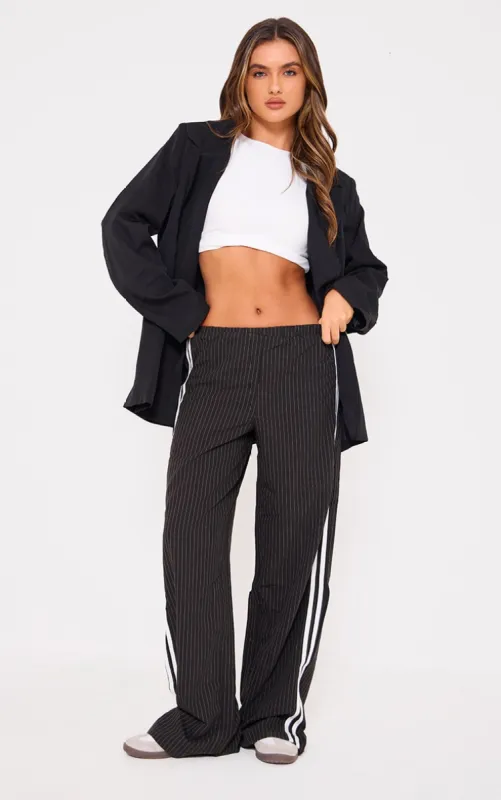 Black Pinstripe Side Stripe Detail Drawstring Low Waist Trousers sold by Pretty Little Thing