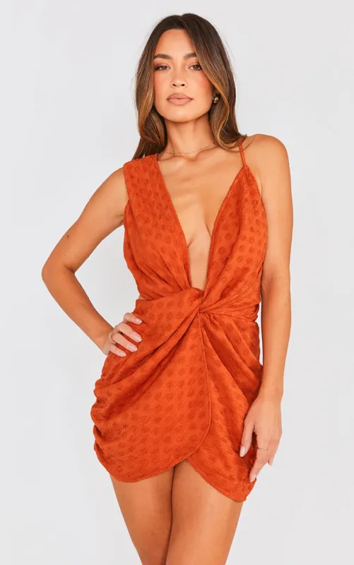 Burnt Orange Textured Plunge Knot Detail Bodycon Dress sold by Pretty Little Thing