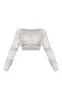 Petite Cream Crochet Long Sleeve Crop Top sold by Pretty Little Thing
