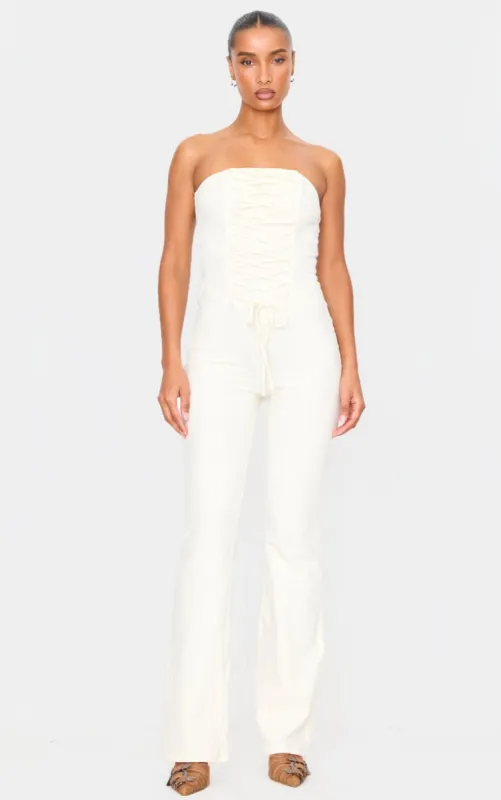 Cream Bandeau Corset Lace Up Straight Leg Jumpsuit sold by Pretty Little Thing