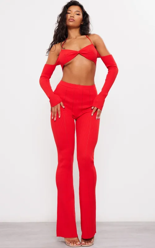 Red Rib Knit Flared Trousers sold by Pretty Little Thing