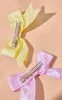 Multi Gingham 2 Pack Bow Hair Clips sold by Pretty Little Thing