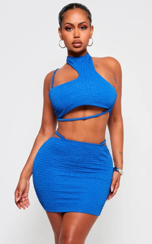 Shape Blue Textured Asymmetrical Strappy Crop Top sold by Pretty Little Thing