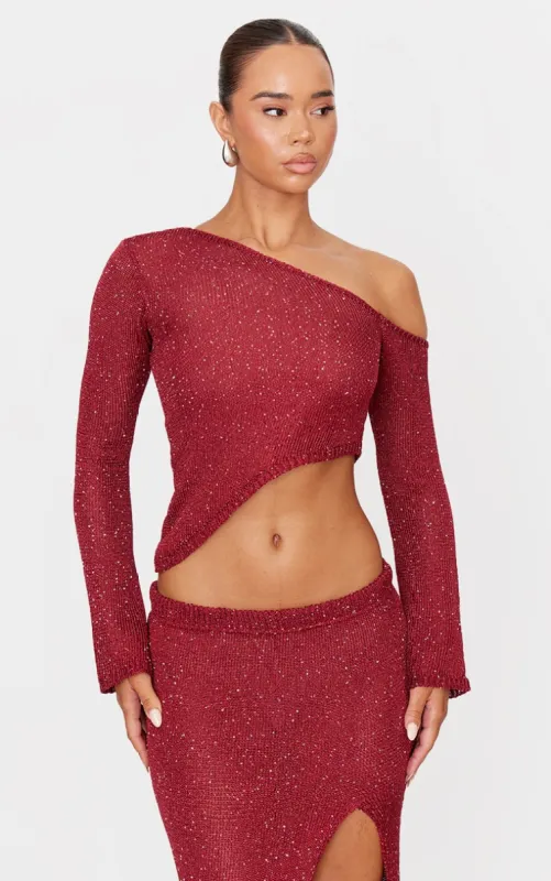 Wine Sequin Knit Asymmetric Long Sleeve Crop Top sold by Pretty Little Thing