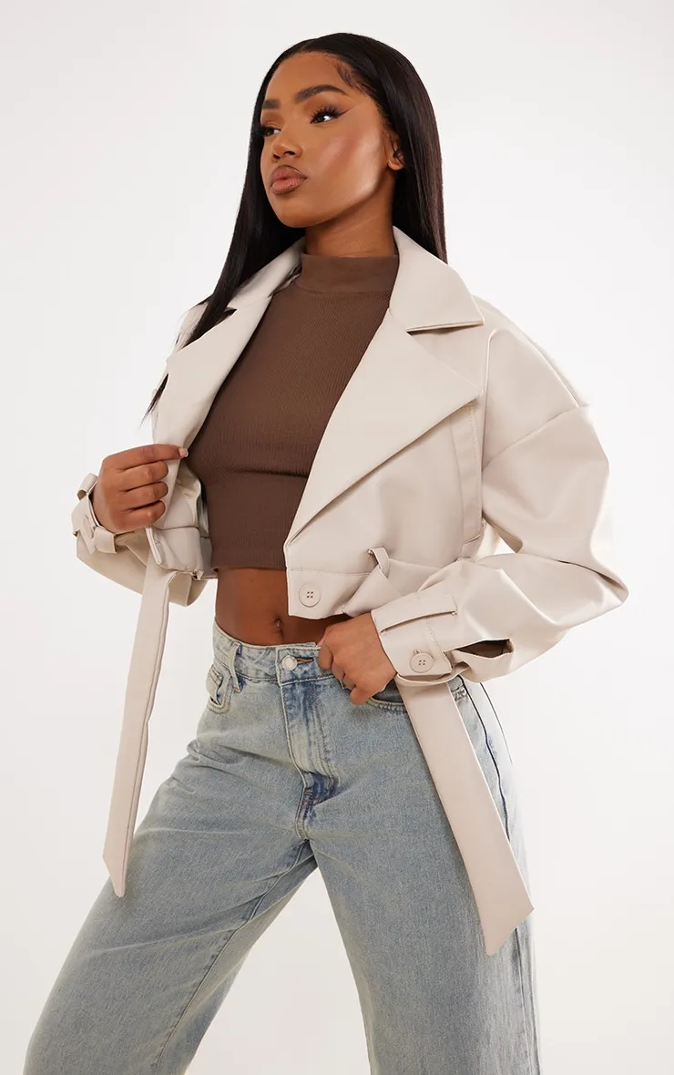 Stone Oversized Belted Hem Cropped Biker Jacket sold by Pretty Little Thing