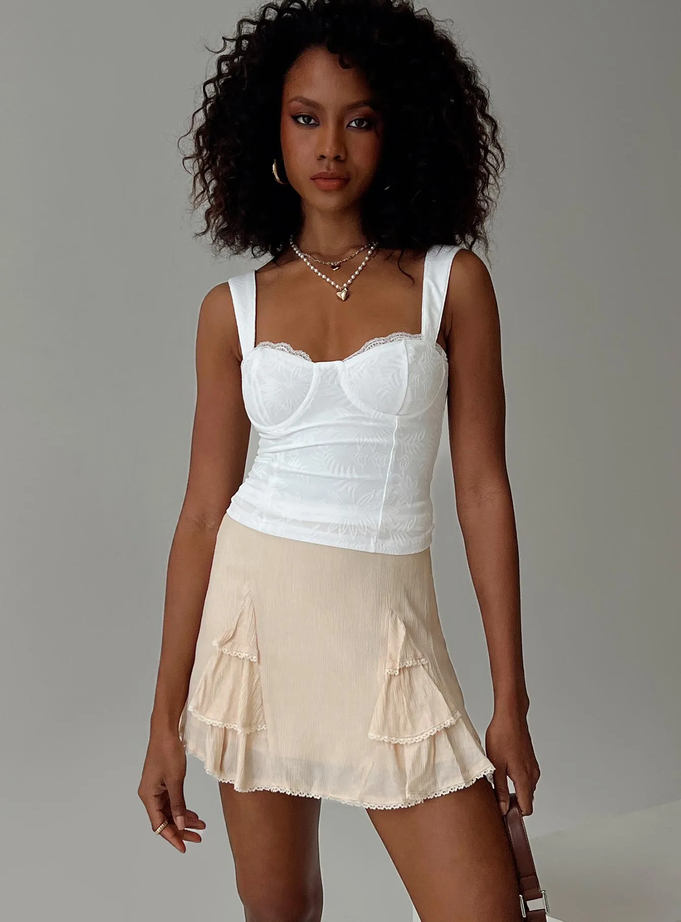 Foalie Ruffle Mini Skirt Beige sold by Princess Polly