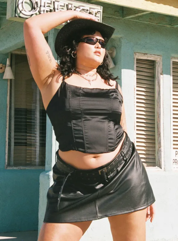 Torridon Eyelet Belt Faux Leather Mini Skirt Black Curve sold by Princess Polly