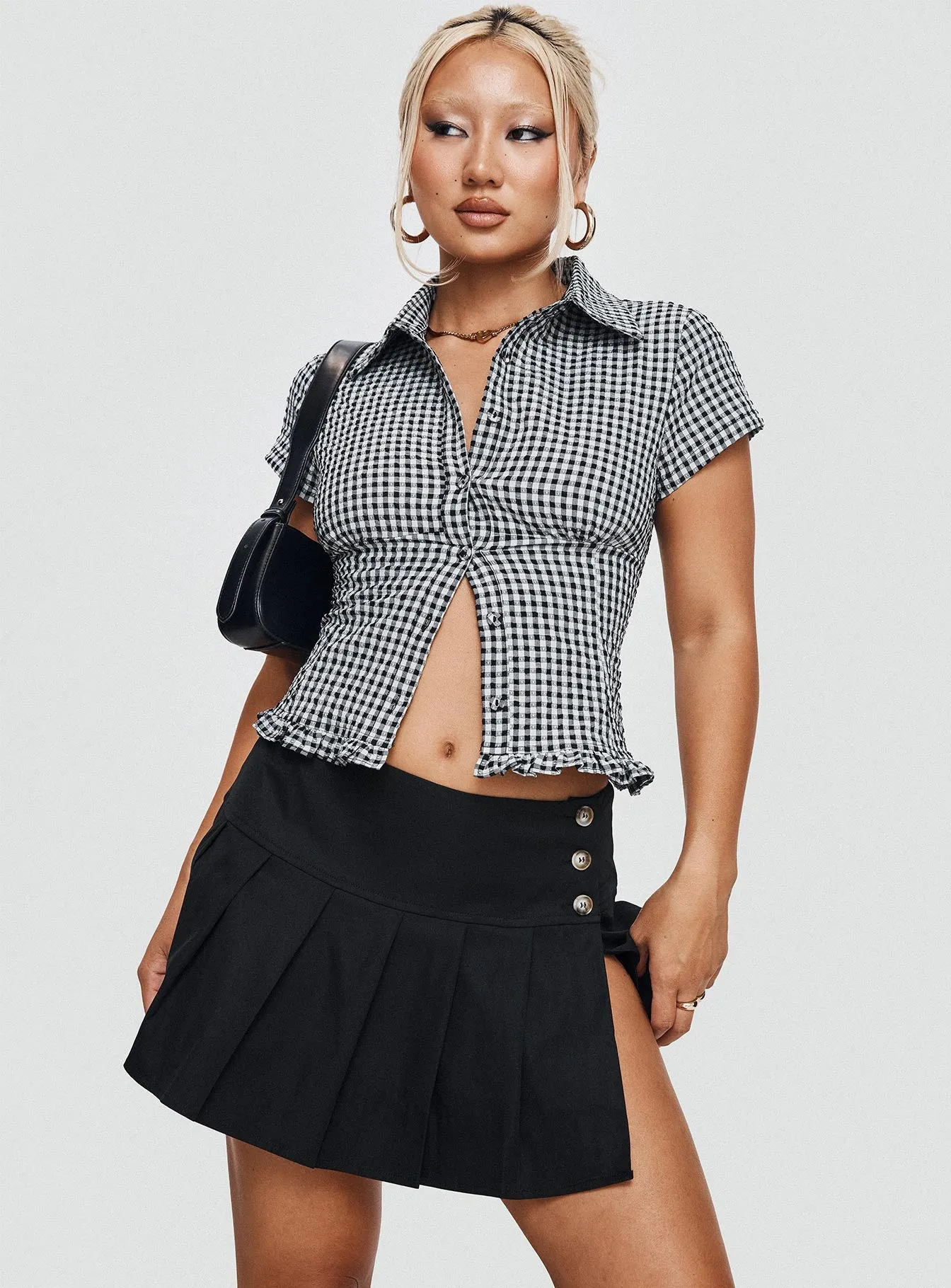 Anubis Pleat Mini Skirt Black sold by Princess Polly