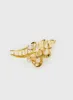 All That Glimmers Clip Gold sold by Princess Polly