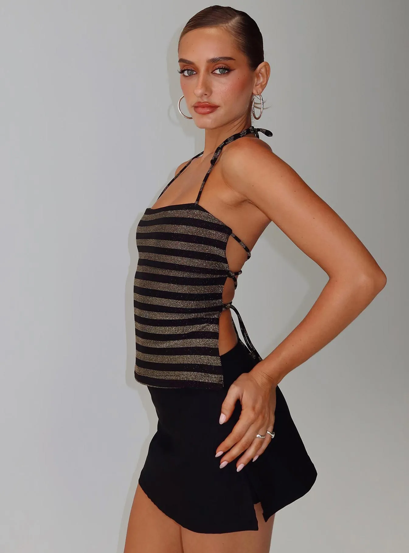 The Player Backless Tie Neck Top Gold / Black Stripe sold by Princess Polly
