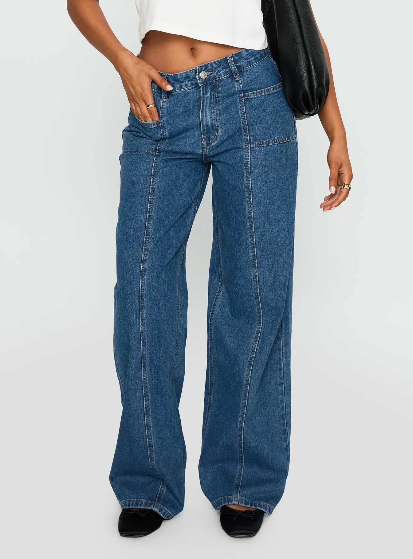 Taji Mid Rise Wide Leg Jeans Dark Blue sold by Princess Polly
