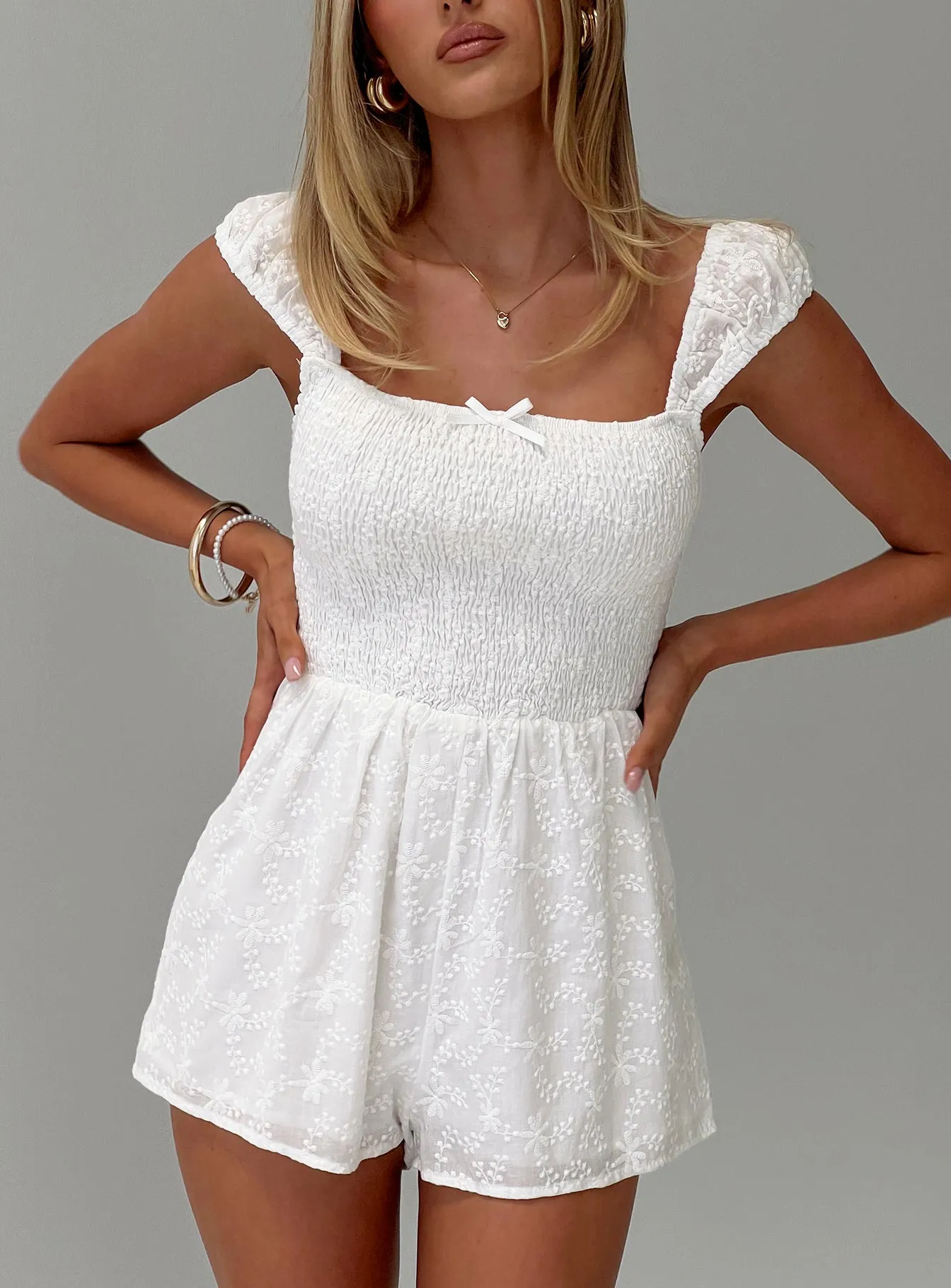 Royal Gleam Romper White sold by Princess Polly