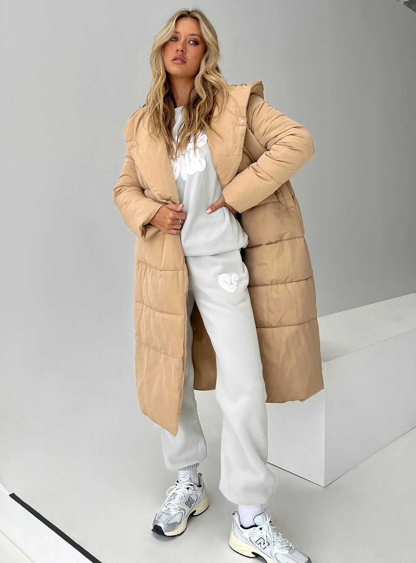 Philo Longline Hooded Puffer Jacket Beige sold by Princess Polly