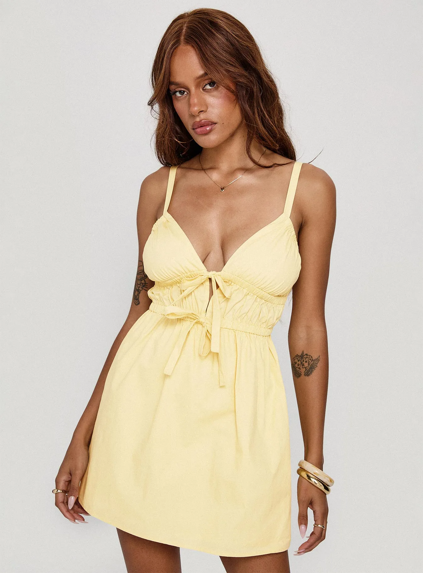 Viviette Ruched Mini Dress Lemon sold by Princess Polly