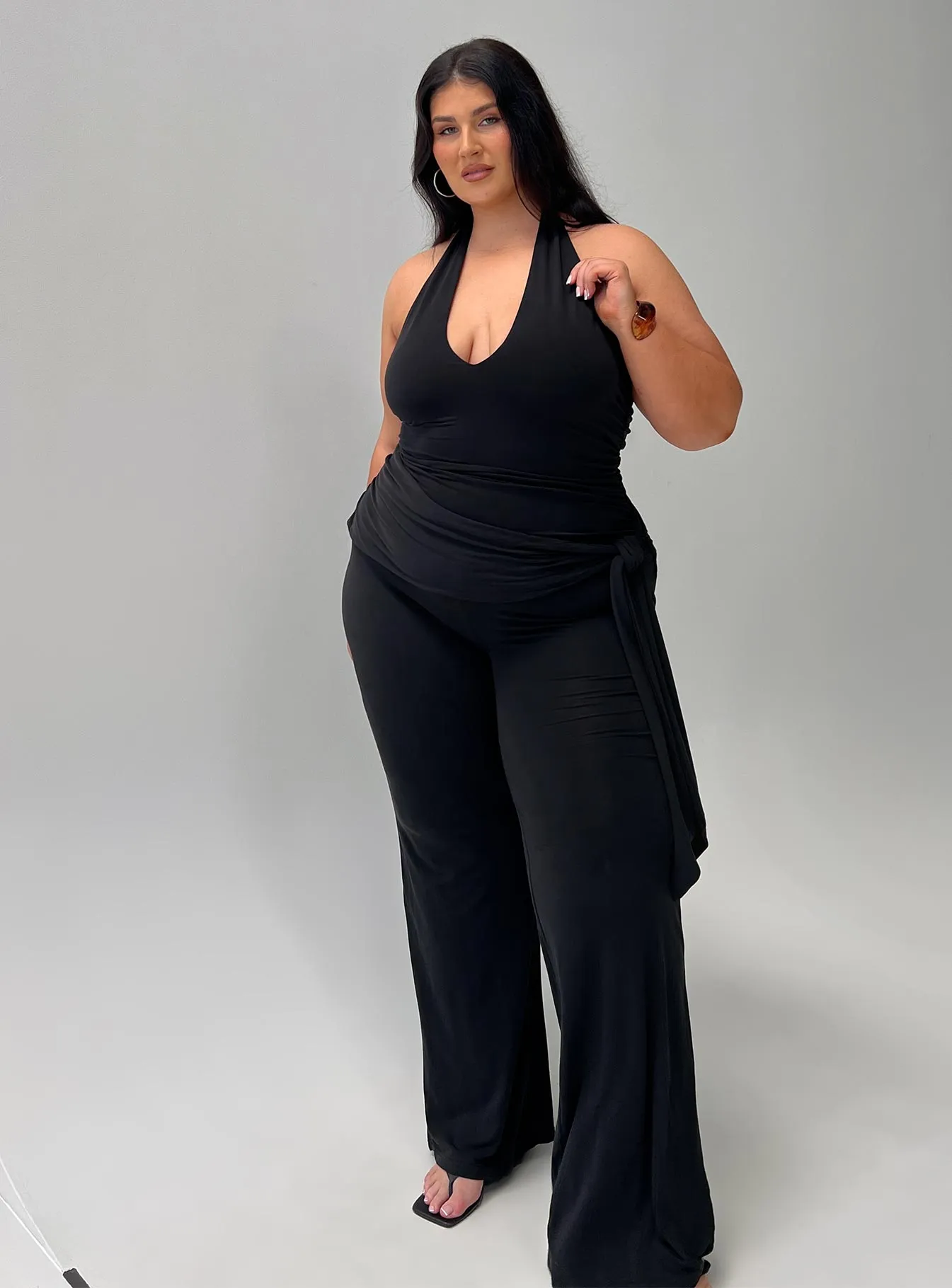 Enchantress Wide Leg Jumpsuit Black Curve sold by Princess Polly