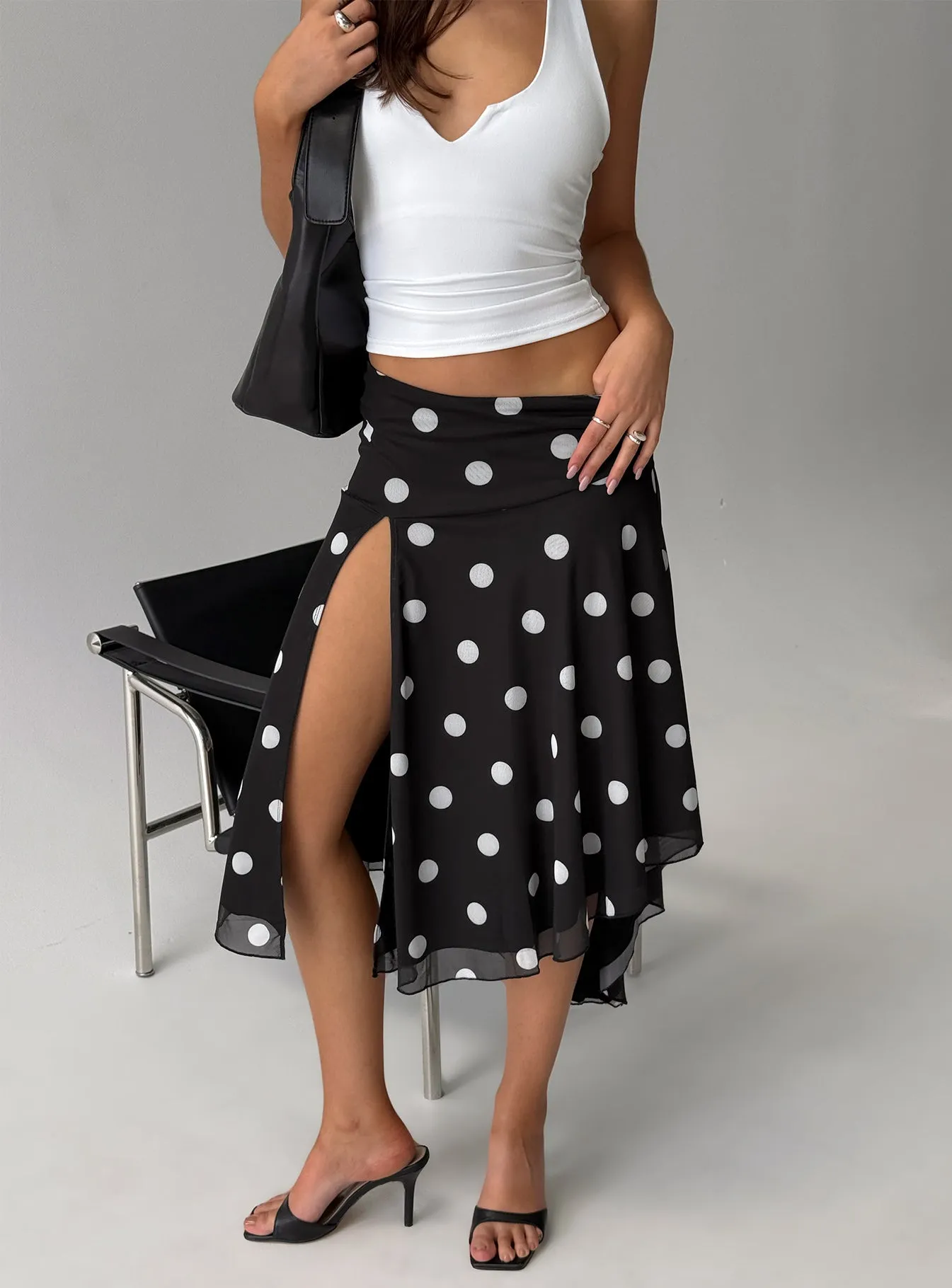 Dulciana High Split Asymmetrical Midi Skirt Black / Polka Dot sold by Princess Polly