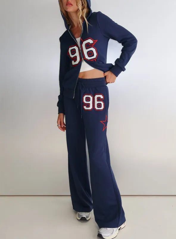 Kari Distressed Patch Track Pant Navy Multi sold by Princess Polly