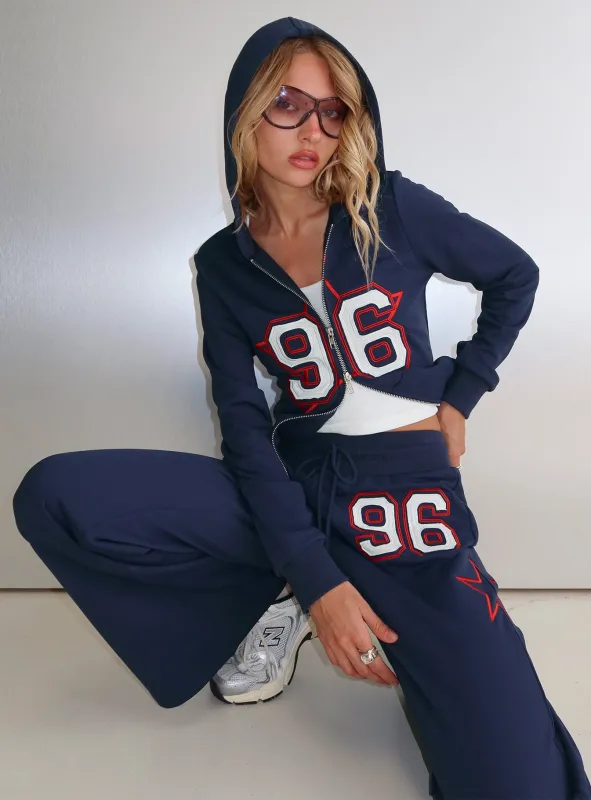 Kari Distressed Zip Through Top Navy Multi sold by Princess Polly