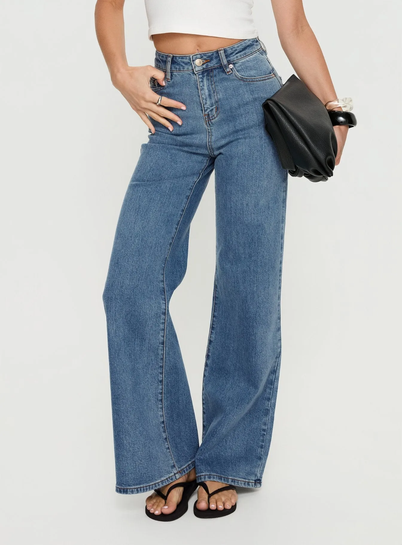 Thearlie High Rise Flared Jeans Mid Blue Wash sold by Princess Polly