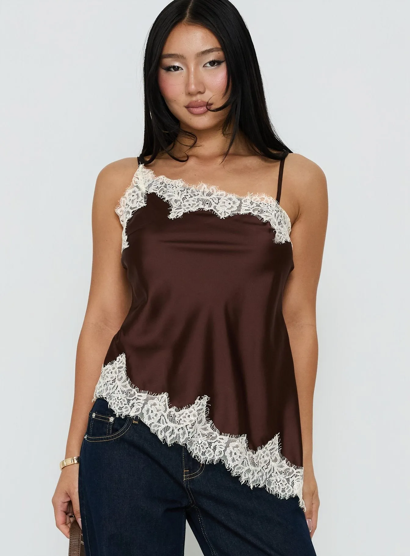 Winta Lace Trim Asymmetrical Satin Top Chocolate sold by Princess Polly