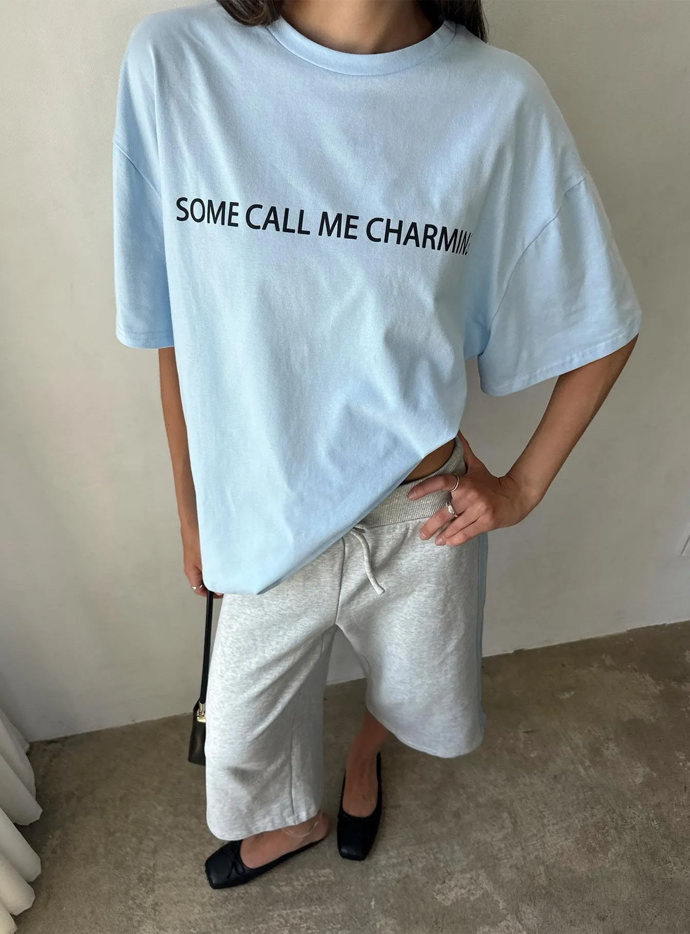 Some Call Me Charming Oversized Graphic Tee Light Blue sold by Princess Polly