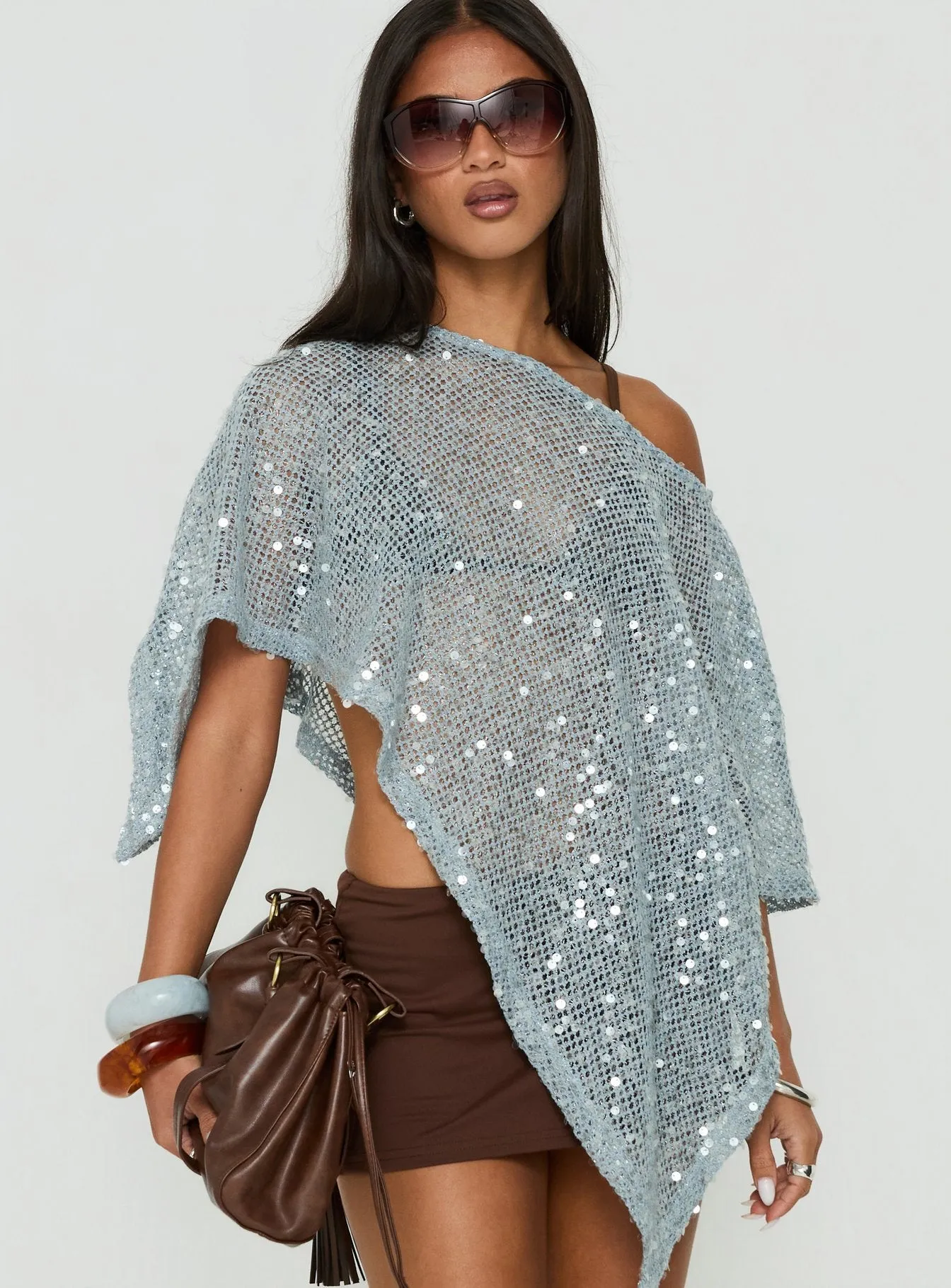 Grotto Asymmetrical Boat Neck Poncho Blue Sparkle sold by Princess Polly