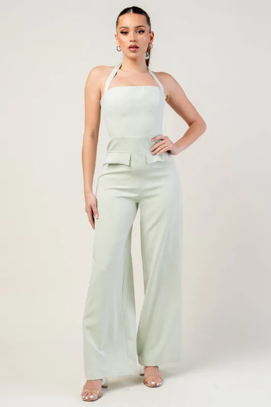 PJWS11236ETP-W / THICK STRETCH WOVEN HALTER NECK JUMPSUIT WITH FAUX POCKET sold by privy