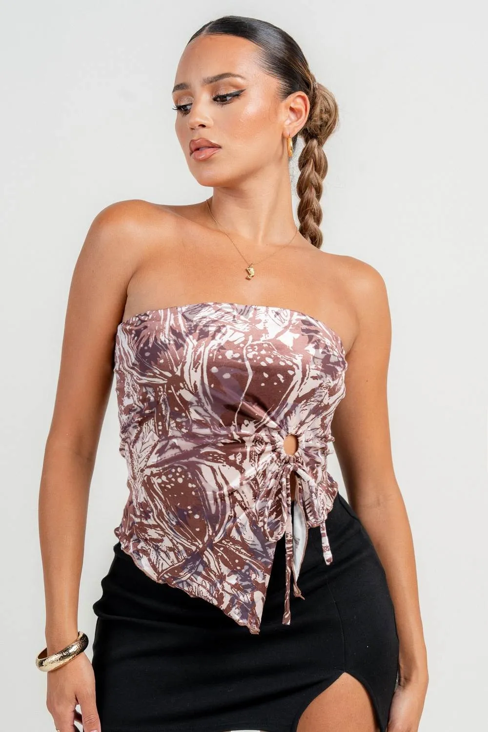 HT4121S / STRAPLESS SLIT ABSTRACT CROP TOP sold by privy