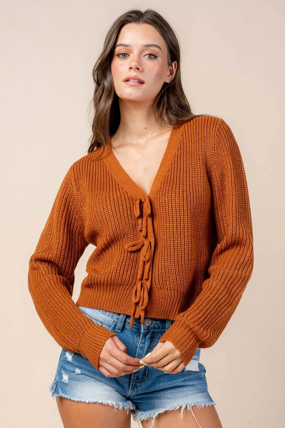 CG60069B / SWEATER CARDIGAN WITH FRONT BOW DETAILS sold by privy