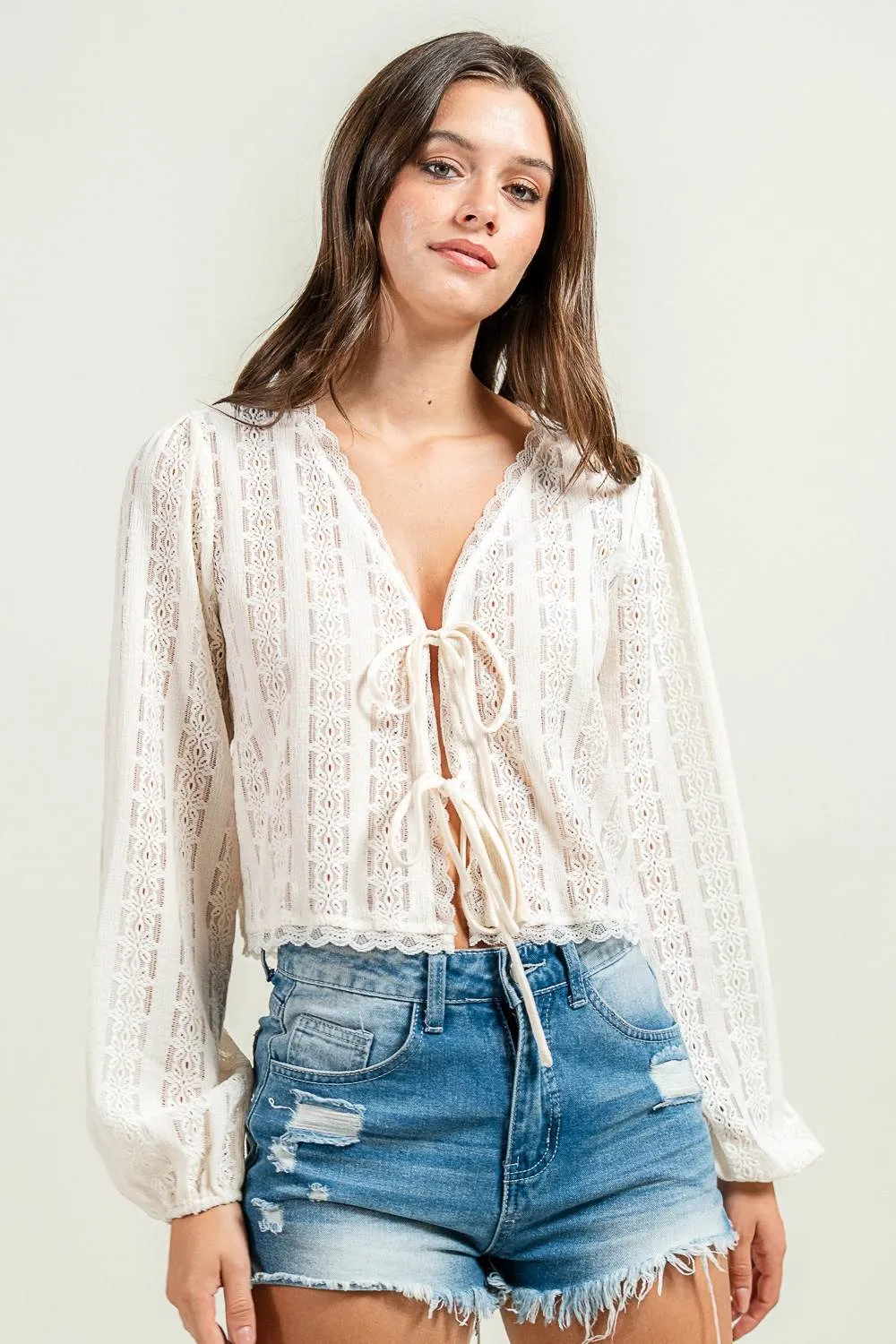 CT10616K / NOVELTY LOOKING TEXTURED L/S KNIT TOP W. FRONT TIES sold by privy