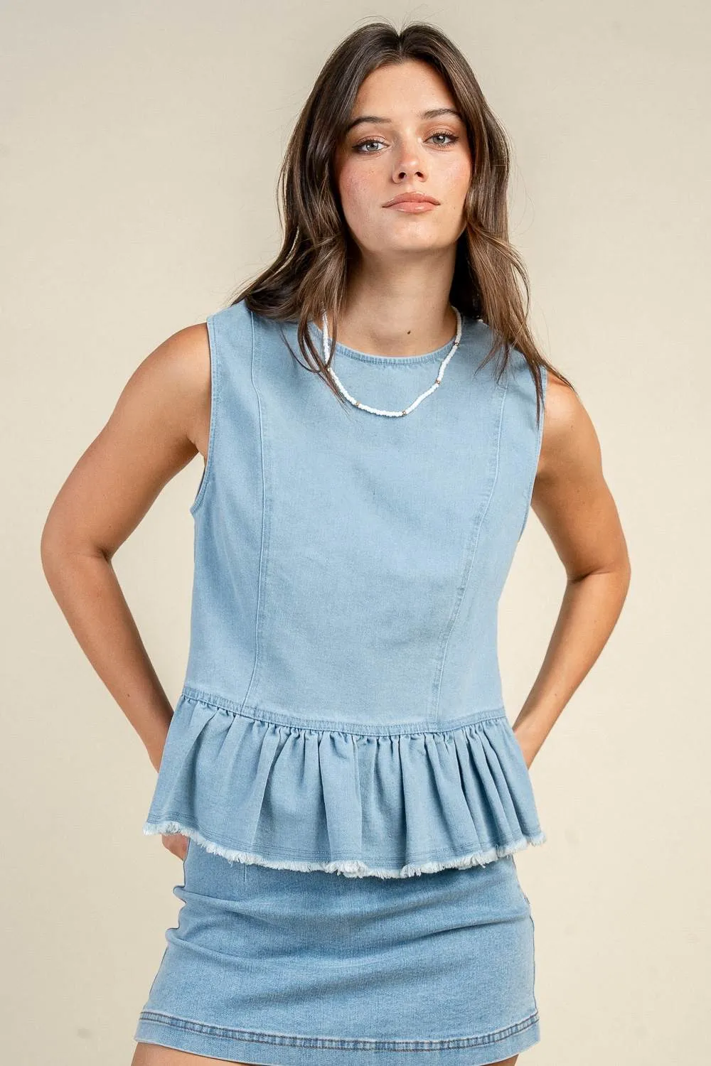 BT3453N / PEPLUM CREW NECK SLEEVELESS TOP W/ BUTTON UP BACK sold by privy