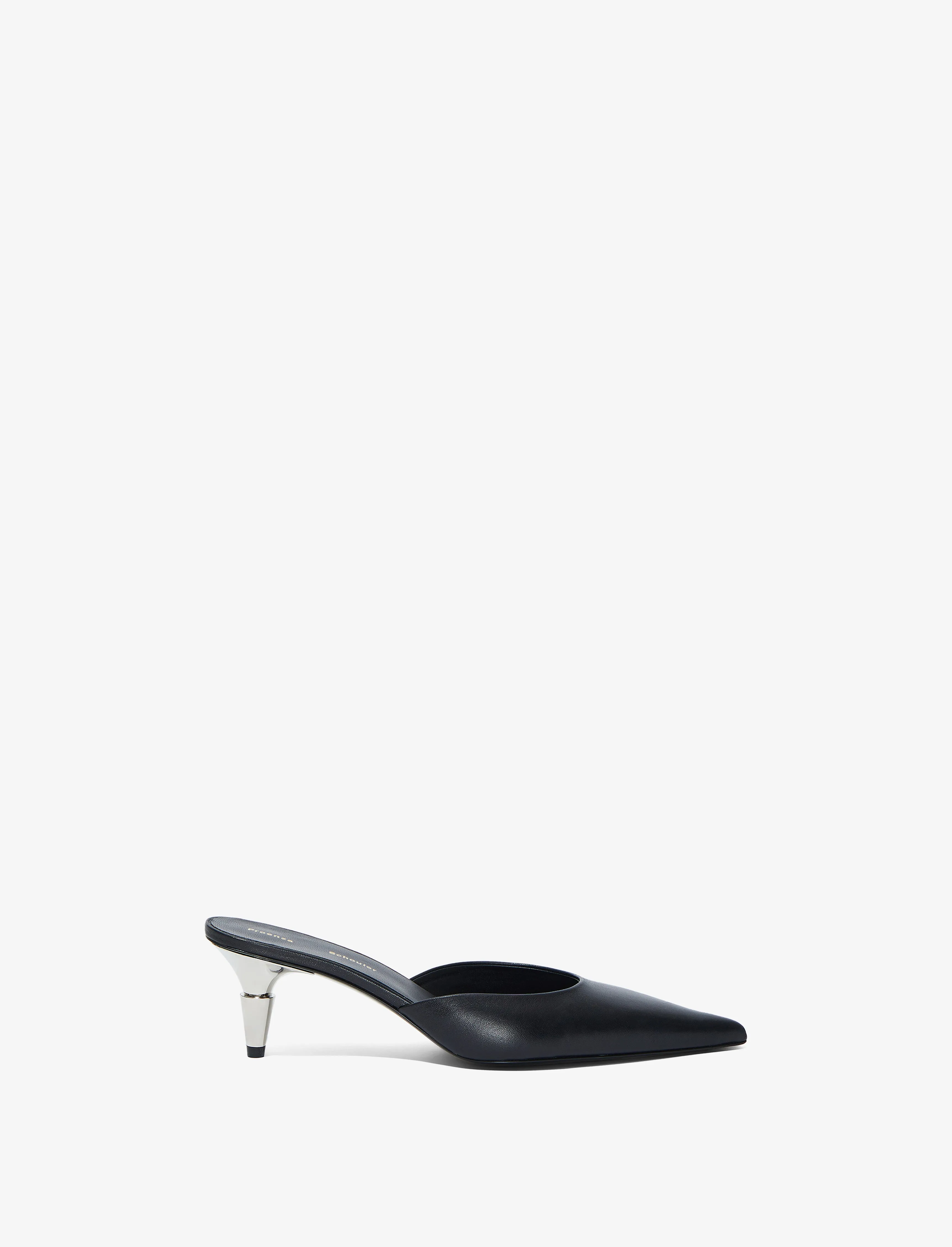 Spike Mules sold by Proenza Schouler