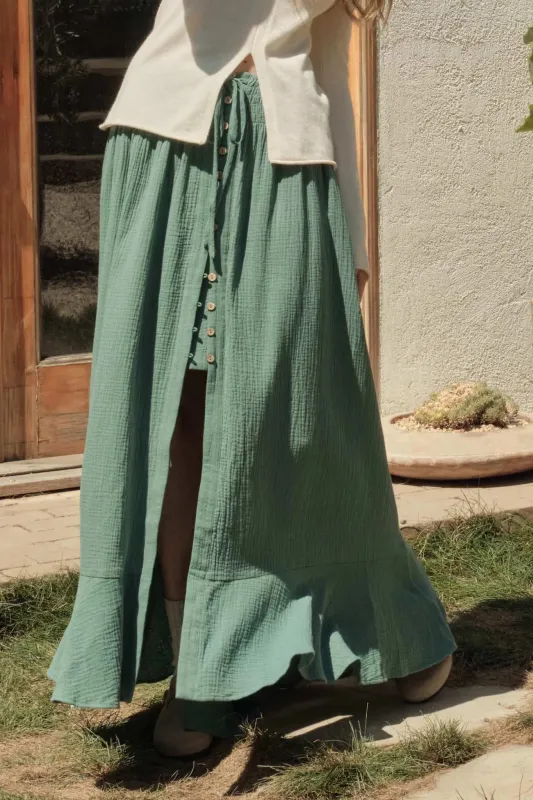 In the Wind Crinkle Cotton Button-Front Maxi Skirt sold by Promesa