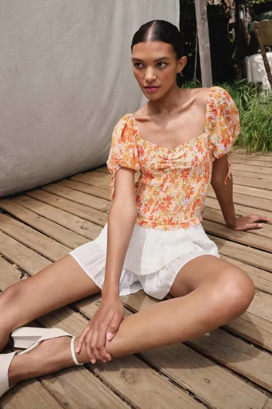 Tangerine Dream Floral Chiffon Smocked Peasant Top sold by Promesa