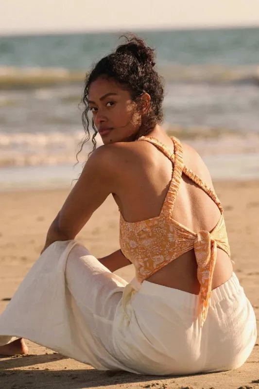 Sunset Blooms Smocked Floral Tie-Back Crop Top sold by Promesa