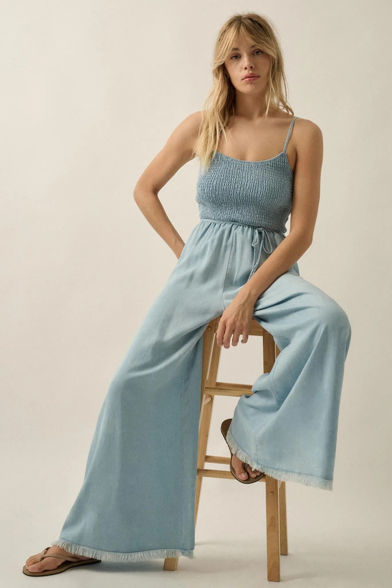 Clear Skies Smocked Denim Wide-Leg Cami Jumpsuit sold by Promesa