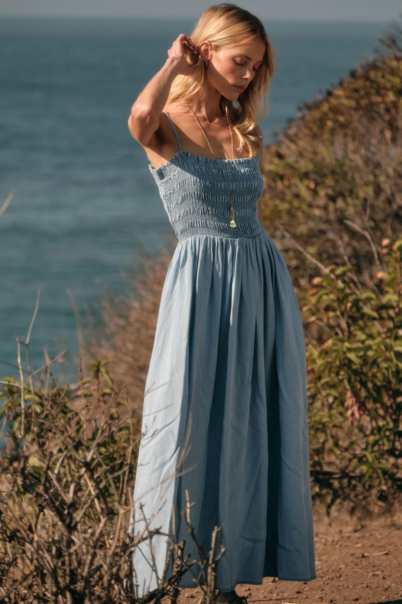 Beauty in Blue Smocked Denim Pocket Midi Dress sold by Promesa