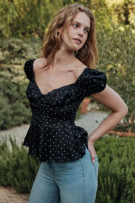 On the Dot Polka Dot Satin Puff-Sleeve Peplum Top made by Promesa