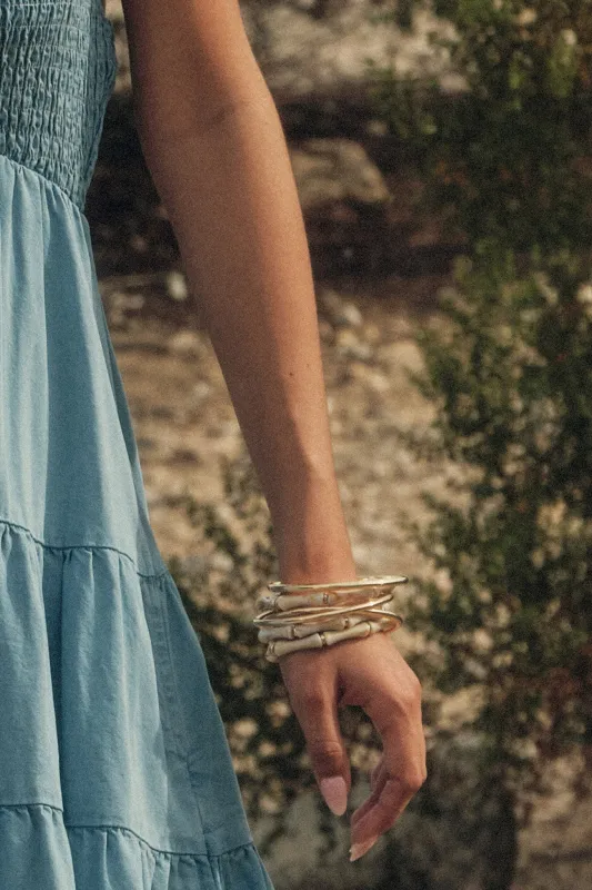 Indio Gold-Tone Bangle and Marble Bead Bracelet Set made by Promesa