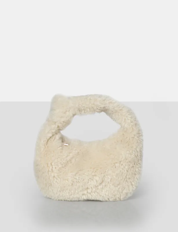 The Lyra Ecru Fluffy Mini Handbag sold by Public Desire